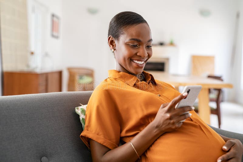 Smiling Pregnant Mid Adult Black Woman Messaging on Mobile Phone Stock  Image - Image of home, cellphone: 234879445