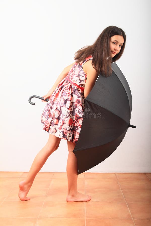 Smiling pretty girl with black umbrella