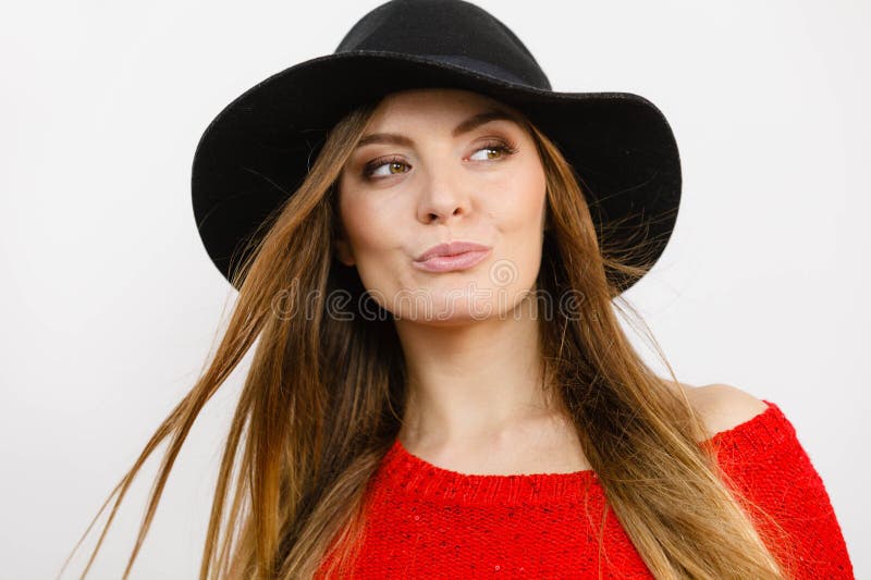 Smiling pretty girl with brown hair and black hat stock images Smiling pretty girl with brown hair and black hat stock images