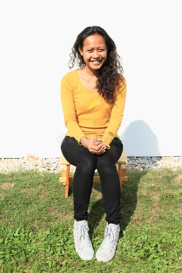 Smiling Pretty Girl Sitting on Wooden ...