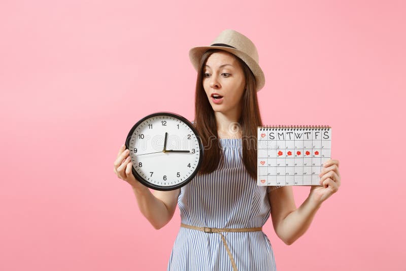 Smiling Pretty Woman In Blue Dress Hat Holding Round Clock Periods