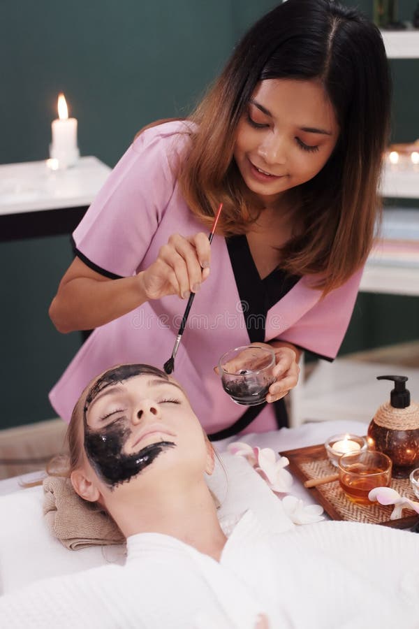 Smiling Professional Asian Thai Massage Therapist Woman Is Making Traditional Head And Facial