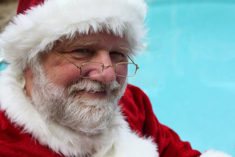 Smiling Santa By a Pool