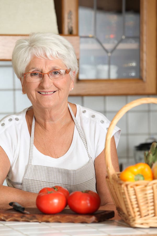 Smiling senior woman in kitchen