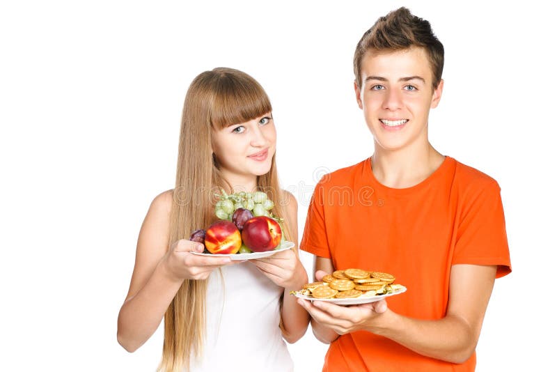 Smiling teenagers shows healthy lunch