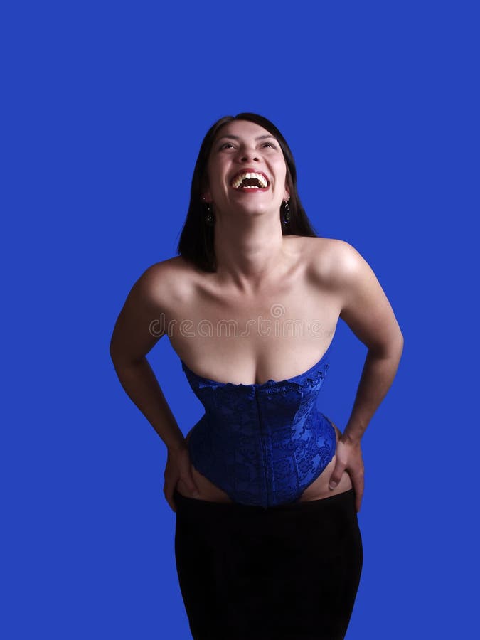 Smiling Woman in Blue Corset Skirt Pulled Down Stock Photo