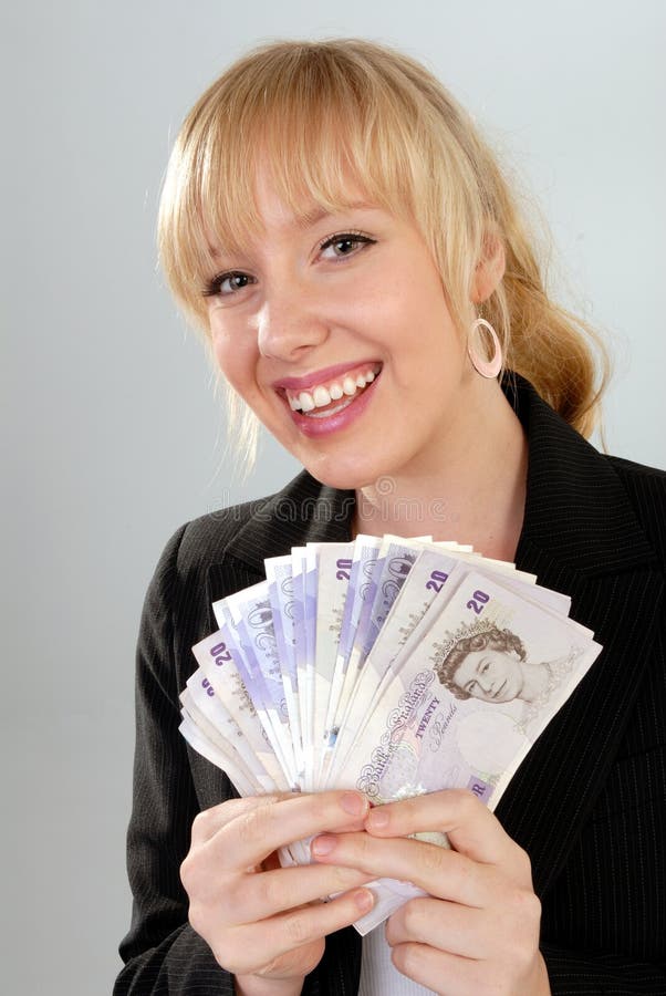 Smiling woman with British currency