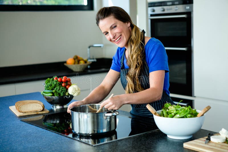 Raw Meat Cooking in Frying Pan on Stove Top Stock Photo - Image of burner,  kitchen: 59614622