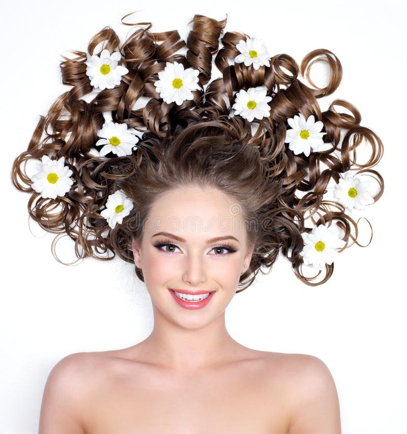 Smiling woman with flowers in hair