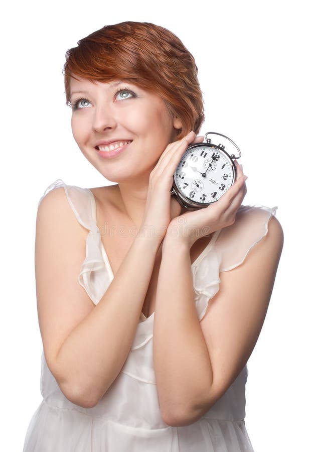 Smiling woman holding alarm clock royalty free stock photo Smiling woman holding alarm clock royalty free stock photo