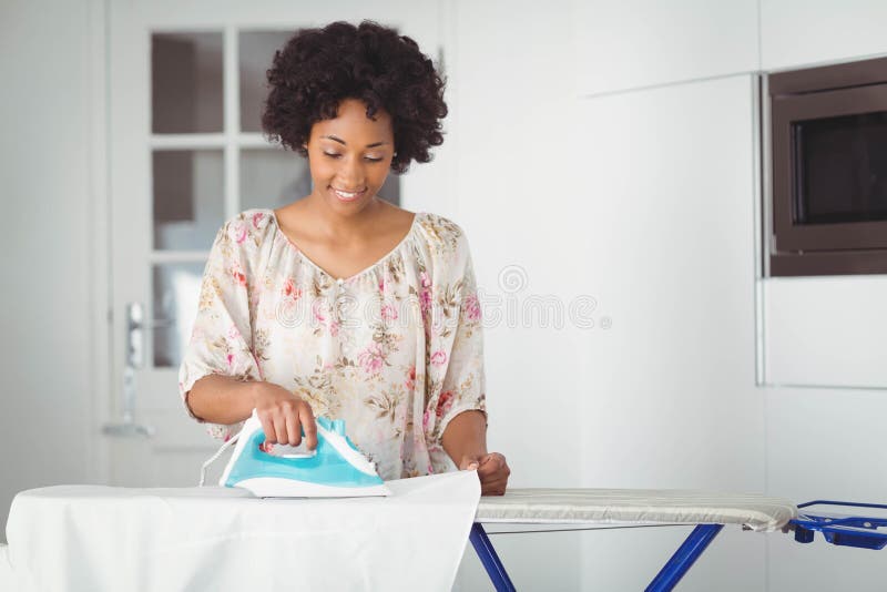 African Woman seamstress Ironing cloth Stock Photo by ©ufabizphoto 181991862