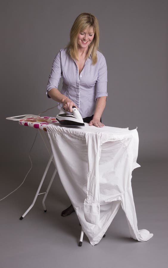 Woman ironing stock photo. Image of shirt, chore, household 53460558