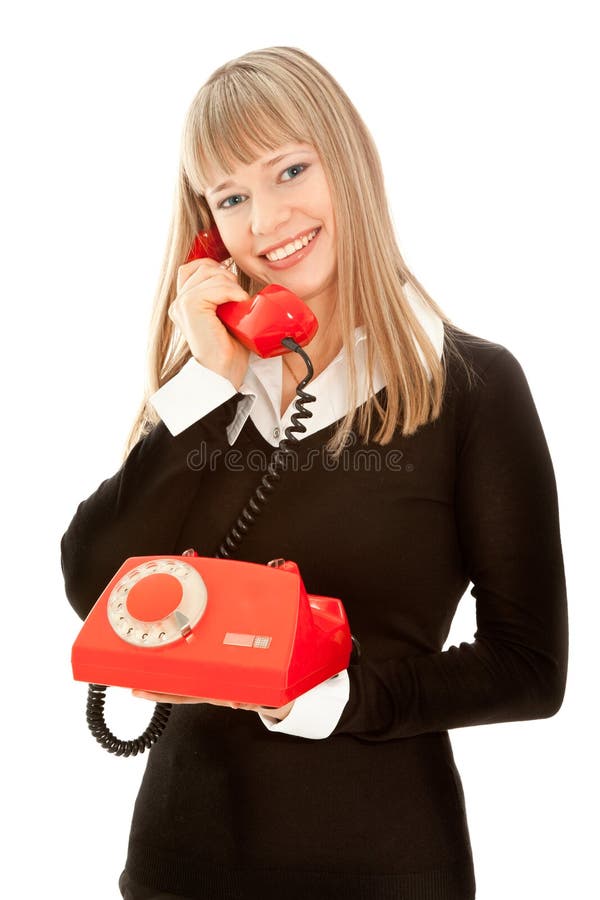 Smiling woman with old telephone