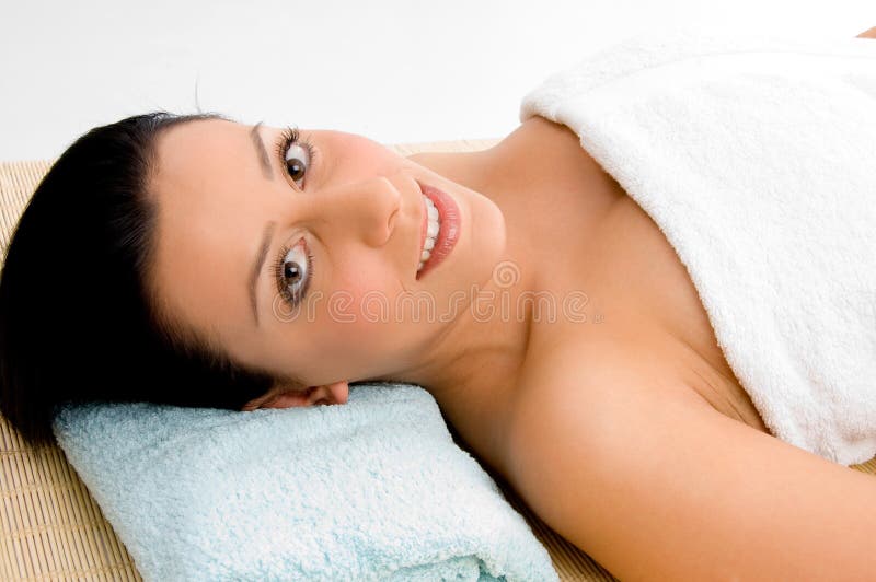 Smiling woman scrubbing her body