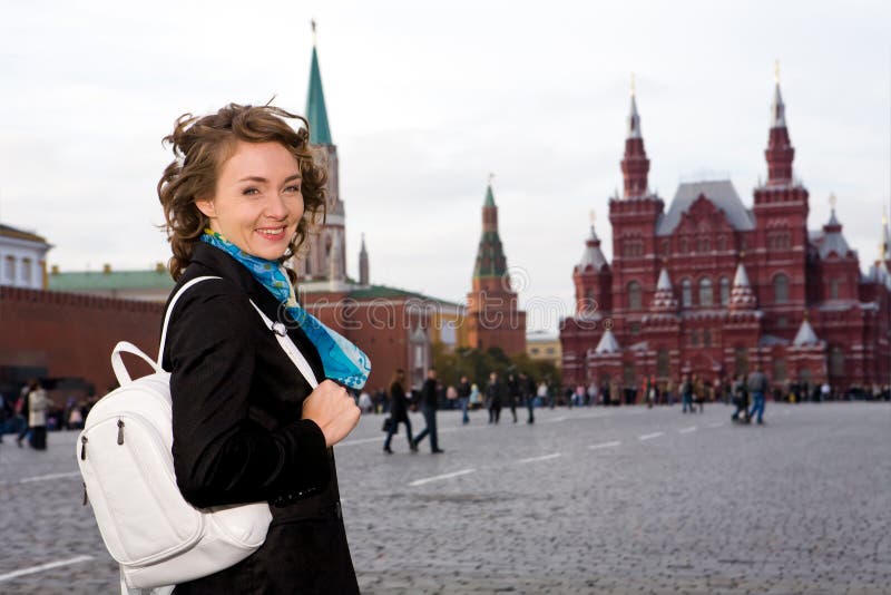 Smiling woman standing on the Red Square in Moscow