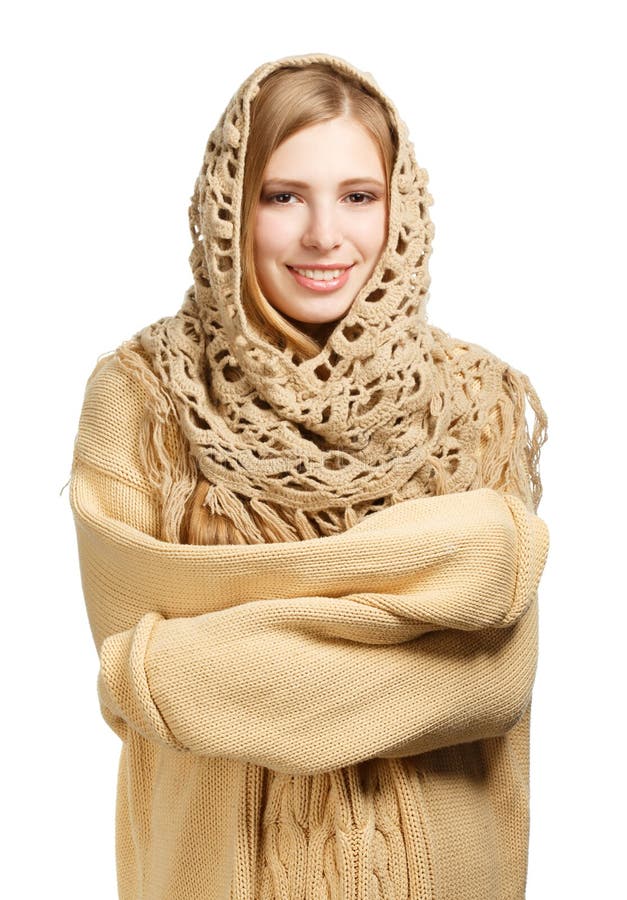 Smiling woman in warm comforter