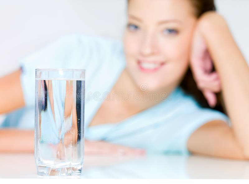 Smiling woman with waters glass