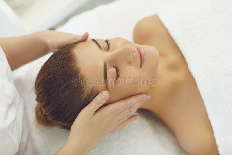 Smiling Womans Face Getting Professional Manual Relaxing Massage From Hands Of Masseur Stock