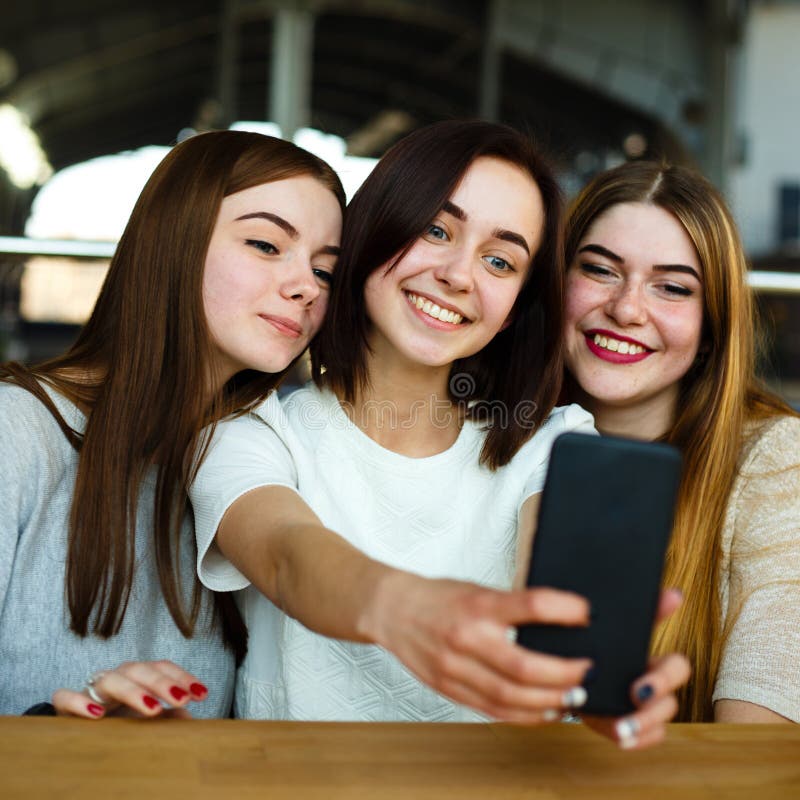 Smiling Women Having Fun and Taking Selfie at Cafe Stock Photo - Image ...