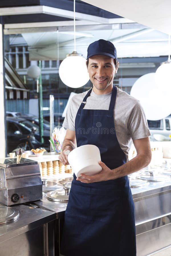 Smiling Worker Holding Bowl at Ice Cream Parlor Stock Photo Image of