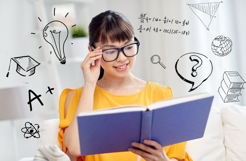 Smiling young asian woman reading book at home