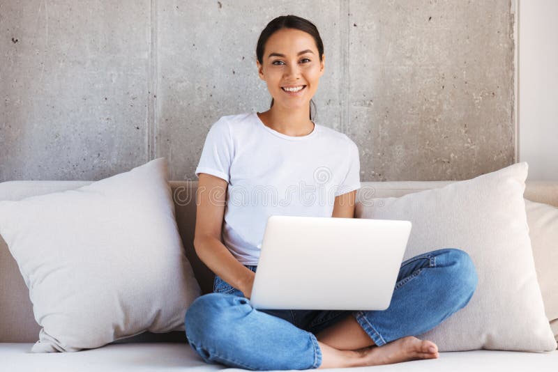 Smiling young asian woman using laptop computer royalty free stock photo Smiling young asian woman using laptop computer royalty free stock photo