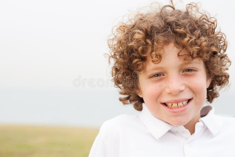 Smiling young boy posing