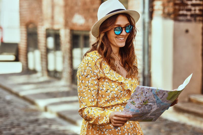 Smiling Young Woman Reading a Map while Exploring Cobblestone St Stock ...