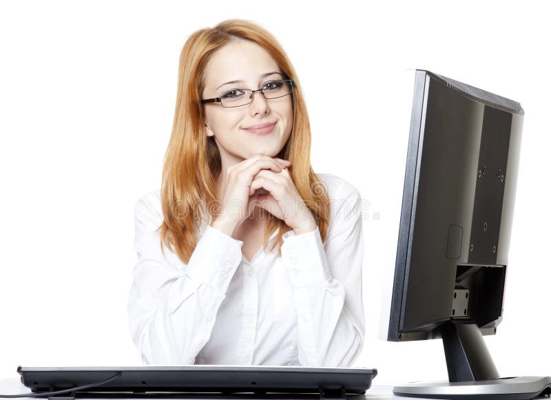 Smiling young business woman using computer