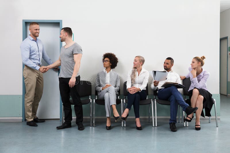 Businessman Shaking Hands With Male Candidate royalty free stock image Businessman Shaking Hands With Male Candidate royalty free stock image