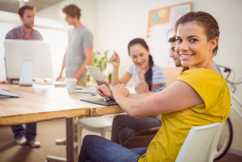 Smiling young businesswoman in a meeting. Portrait of a smiling young businesswoman in a meeting at office royalty free stock images Smiling young businesswoman in a meeting. Portrait of a smiling young businesswoman in a meeting at office royalty free stock images