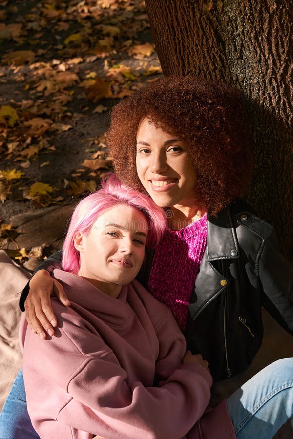 Happy Interracial Lesbian Couple Resting In Park Stock Image Image Of Mixedrace Loving 274420851