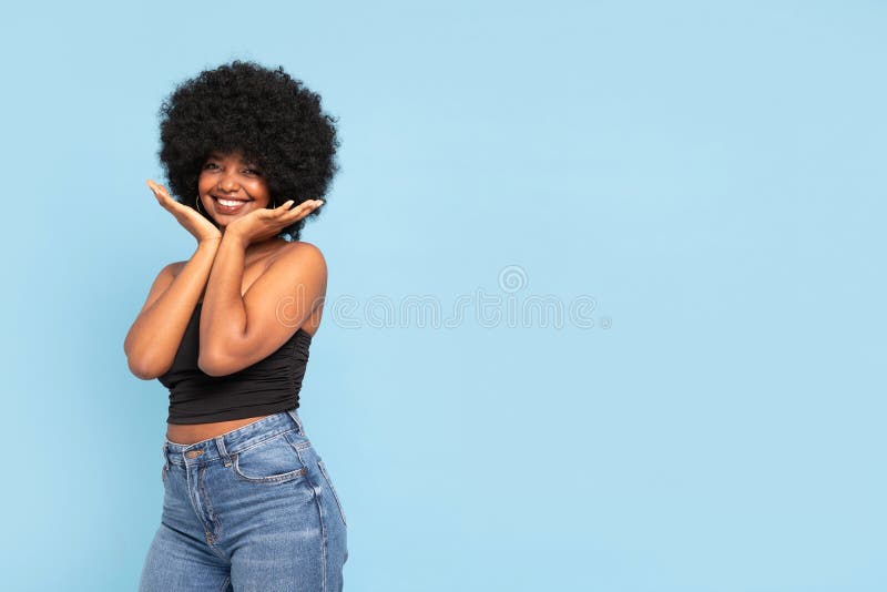 Premium Photo | Beautiful black woman with afro curls hairstyle. smiling  model in sweater and trendy jeans clothes