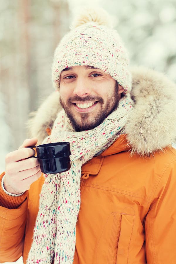 Smiling Young Man with Cup in Winter Forest Stock Photo - Image of ...