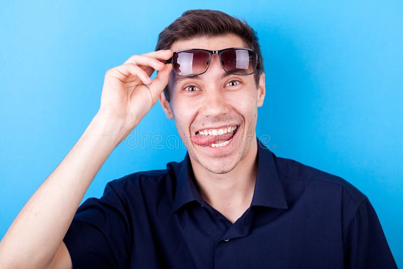 Smiling Young Man Making Silly Faces Stock Photo - Image of adult ...