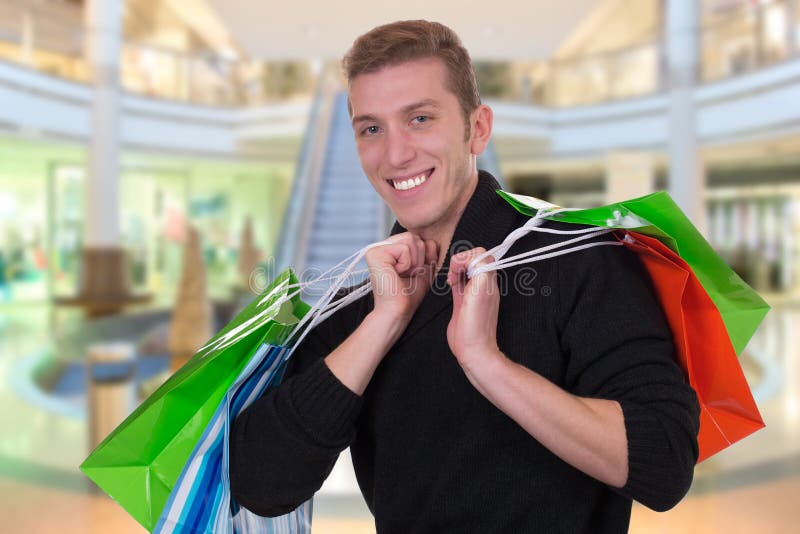 Young Man Buying with Shopping Bags Stock Image Image of young