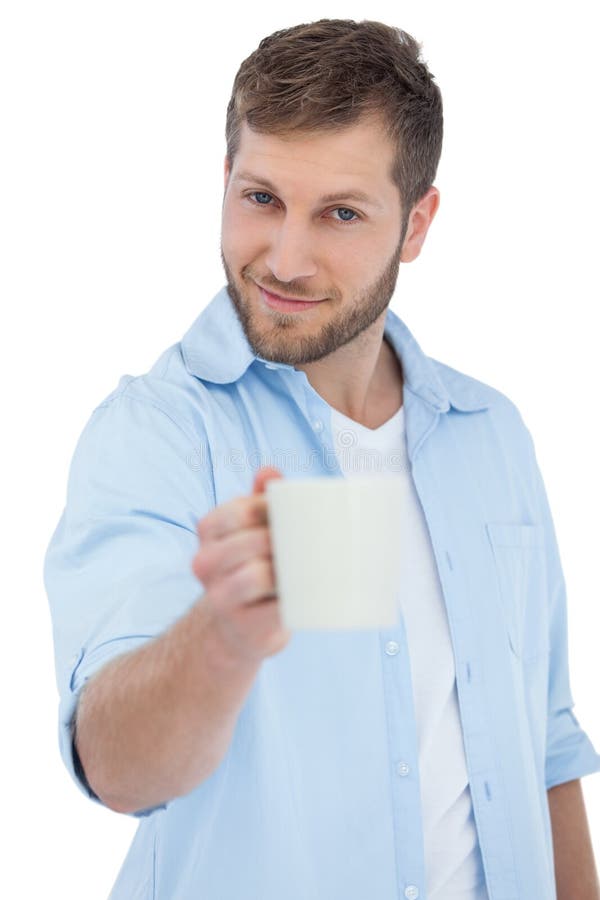 Smiling young model on white background offering a mug. Cut smiling stock images, royalty-free photos and pictures