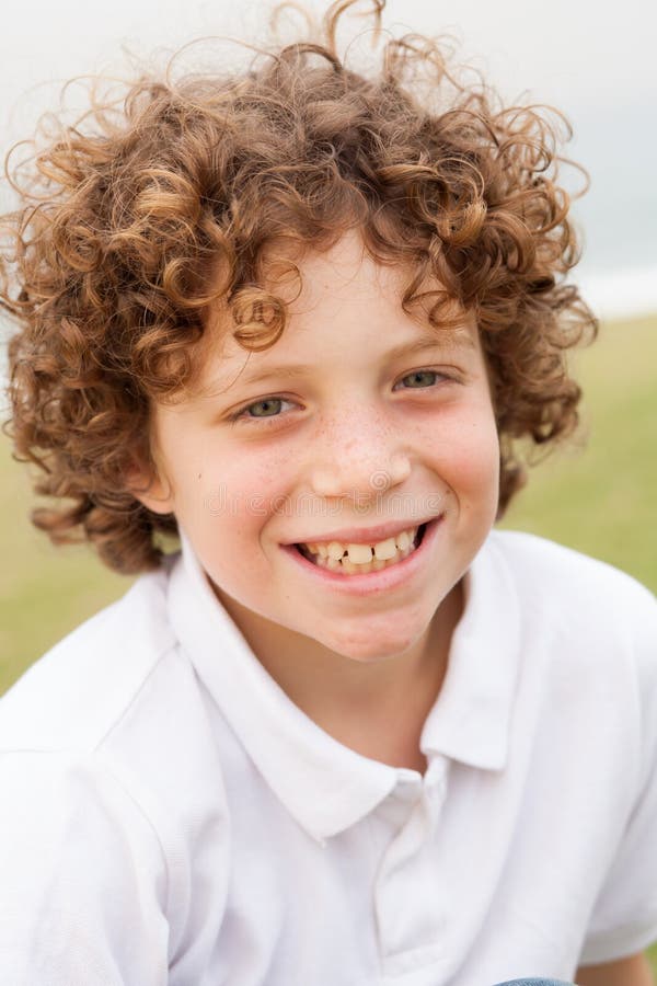 Smiling young pretty boy posing