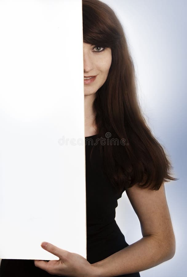 Smiling young woman with a blank board