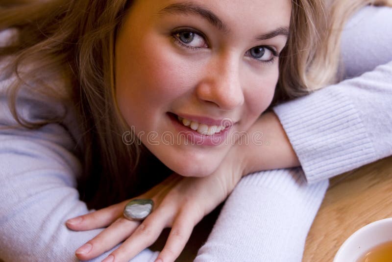 Smiling young woman in cafe