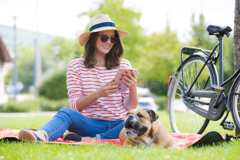 Smiling young woman with digital tablet outdoor royalty free stock photos Smiling young woman with digital tablet outdoor royalty free stock photos