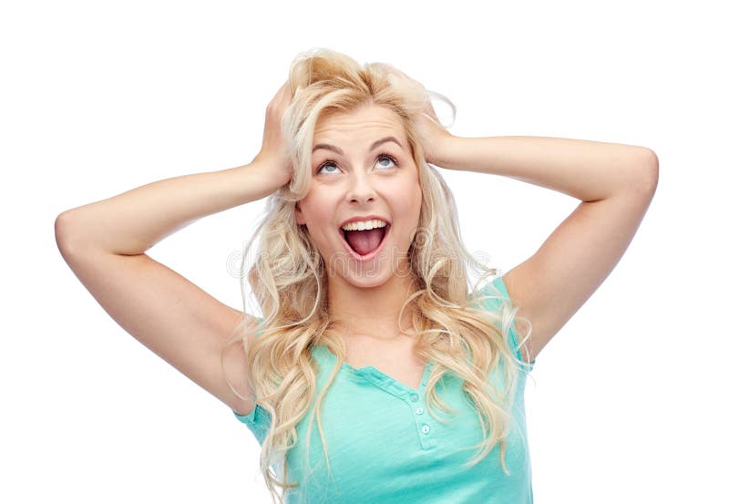 Smiling young woman holding to her head or hair royalty free stock photos Smiling young woman holding to her head or hair royalty free stock photos