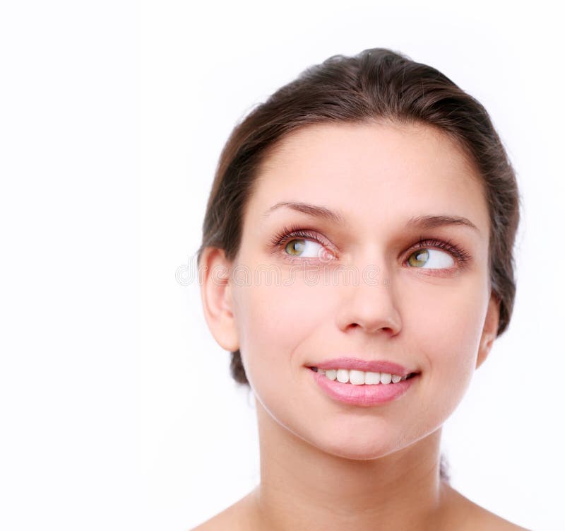 Smiling young woman looking up