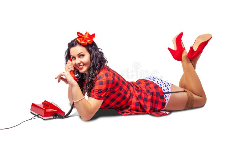 Smiling young woman lying on the floor and talking on phone