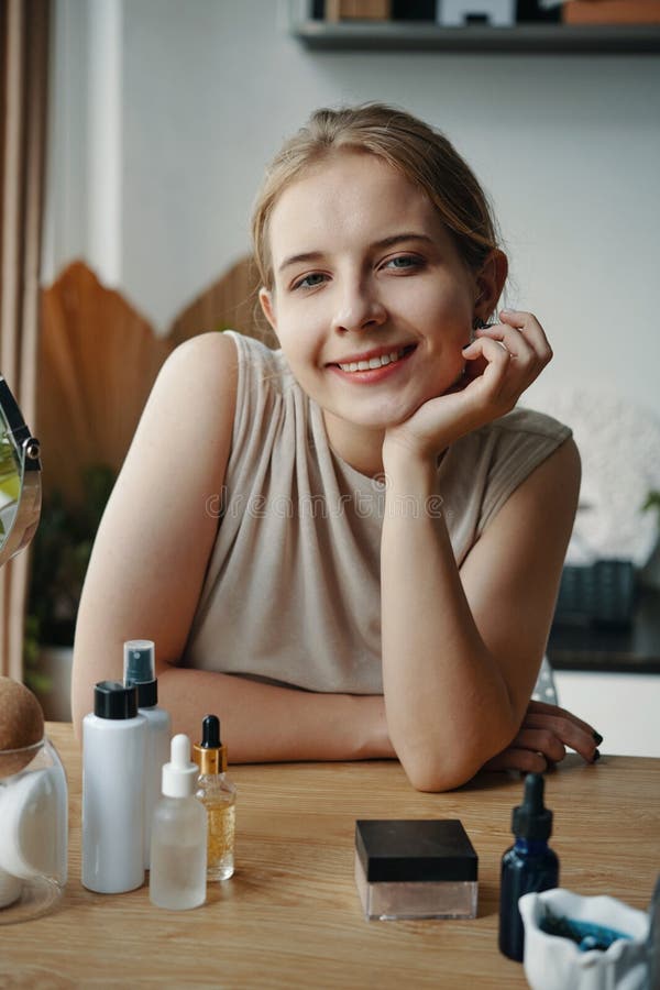 Smiling Young Woman Posing in Home Setting stock photography