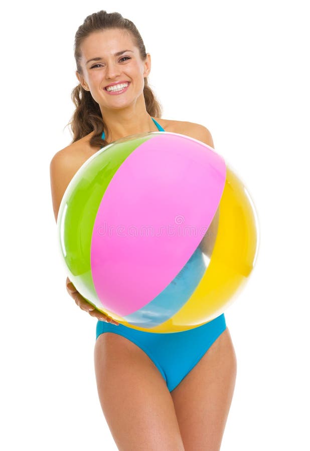 Smiling young woman in swimsuit with beach ball. 