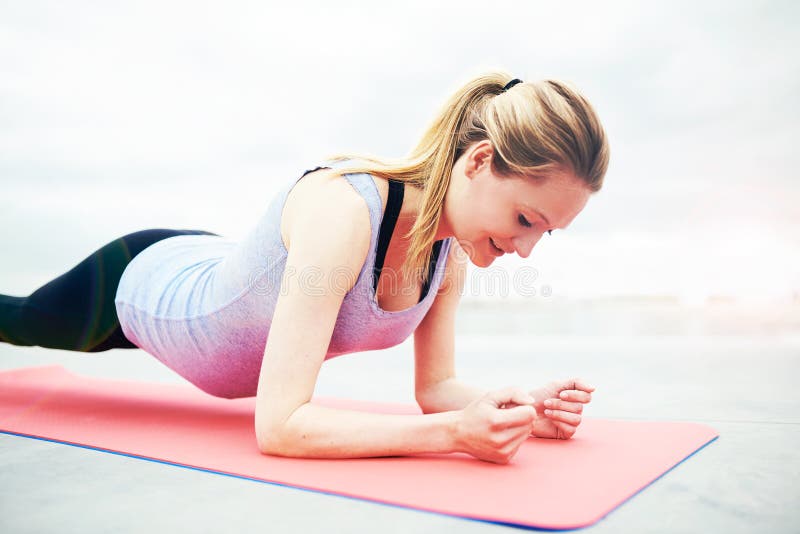 Smiling young woman working out during pregnancy royalty free stock image Smiling young woman working out during pregnancy royalty free stock image