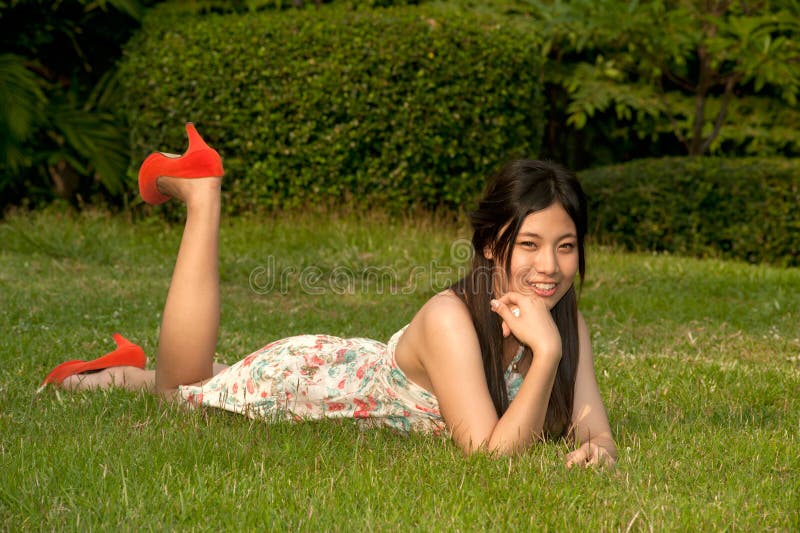 Sweet girl in bikini Asian scandal in the park