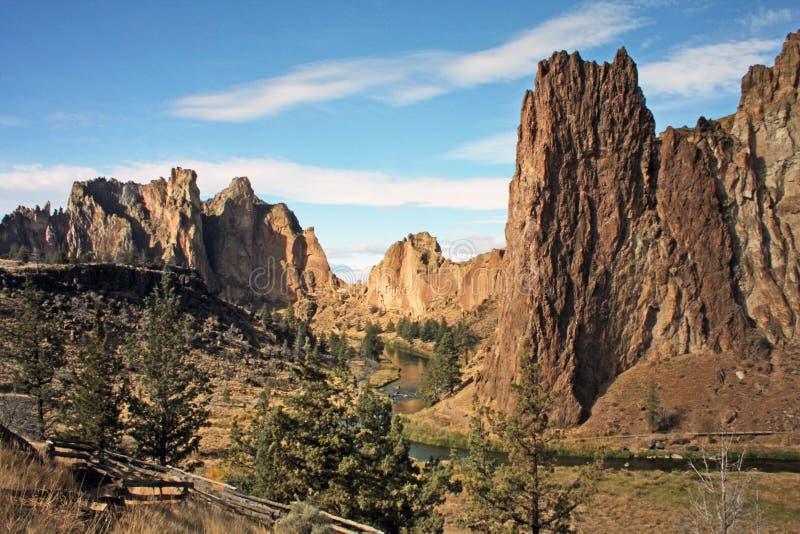 Smith Rock is a 550 foot towering mass of rock just east of Terrebonne, Oregon. The formation originated from an ancient volcanic eruption. A more recent lava flow from the south forced the Crooked River up against its sheer rock face. The result is a spectacularly picturesque site and a rock climber's paradise. More than half a million people visit Smith Rock State Park every year, some to climb the vertical cliffs, others to hike the miles of trails around its base and along the river. Smith Rock could be to Central Oregon what Ayers Rock is to the Australian Outback. Smith Rock is a 550 foot towering mass of rock just east of Terrebonne, Oregon. The formation originated from an ancient volcanic eruption. A more recent lava flow from the south forced the Crooked River up against its sheer rock face. The result is a spectacularly picturesque site and a rock climber's paradise. More than half a million people visit Smith Rock State Park every year, some to climb the vertical cliffs, others to hike the miles of trails around its base and along the river. Smith Rock could be to Central Oregon what Ayers Rock is to the Australian Outback.
