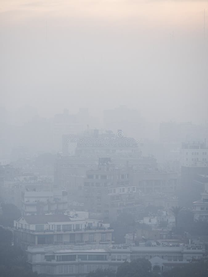 A cityscape of cairo where the background merges into the smog of the city. A cityscape of cairo where the background merges into the smog of the city.